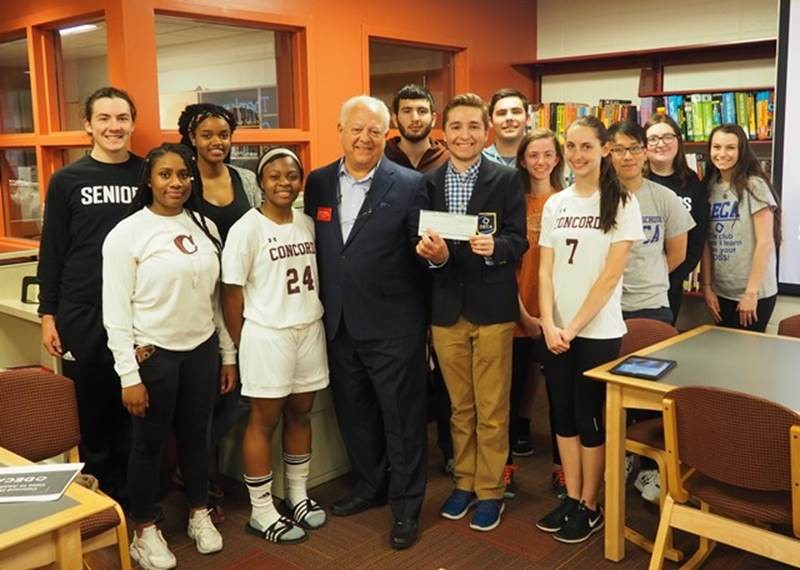 Councilman Weiner presents a check to the Concord High School DECA organization in support of their competing at the DECA International Conference in Anaheim in April 2017.